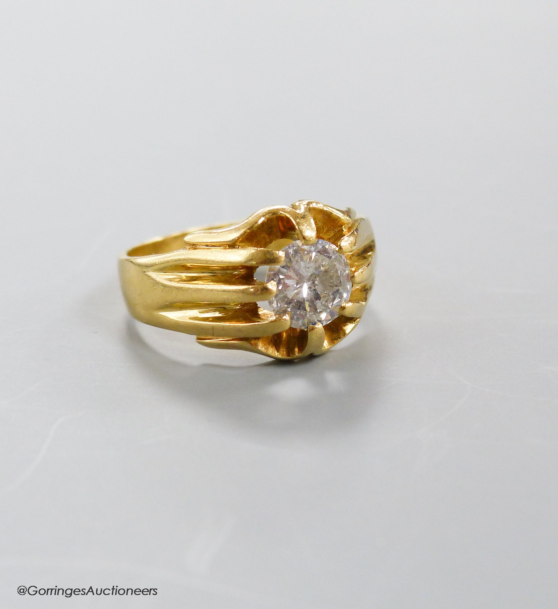 A modern 18ct gold and claw set solitaire diamond ring, size T, gross weight 9.2 grams